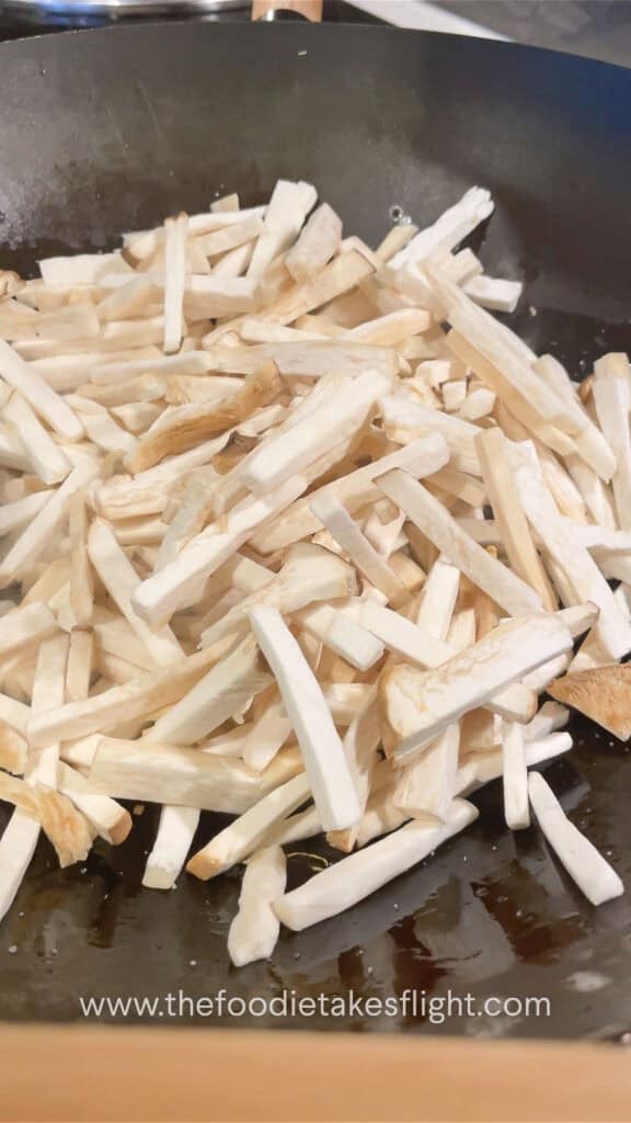 stir frying king oyster mushrooms