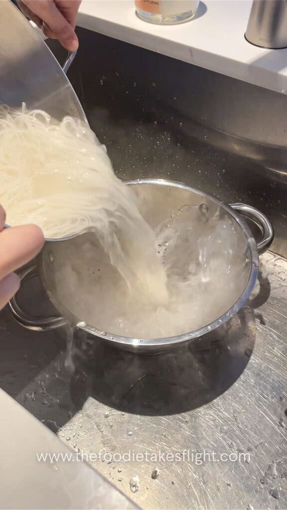 draining rice noodles