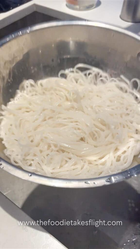 draining rice noodles