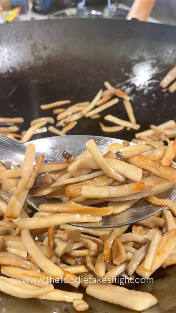 stir frying king oyster mushrooms