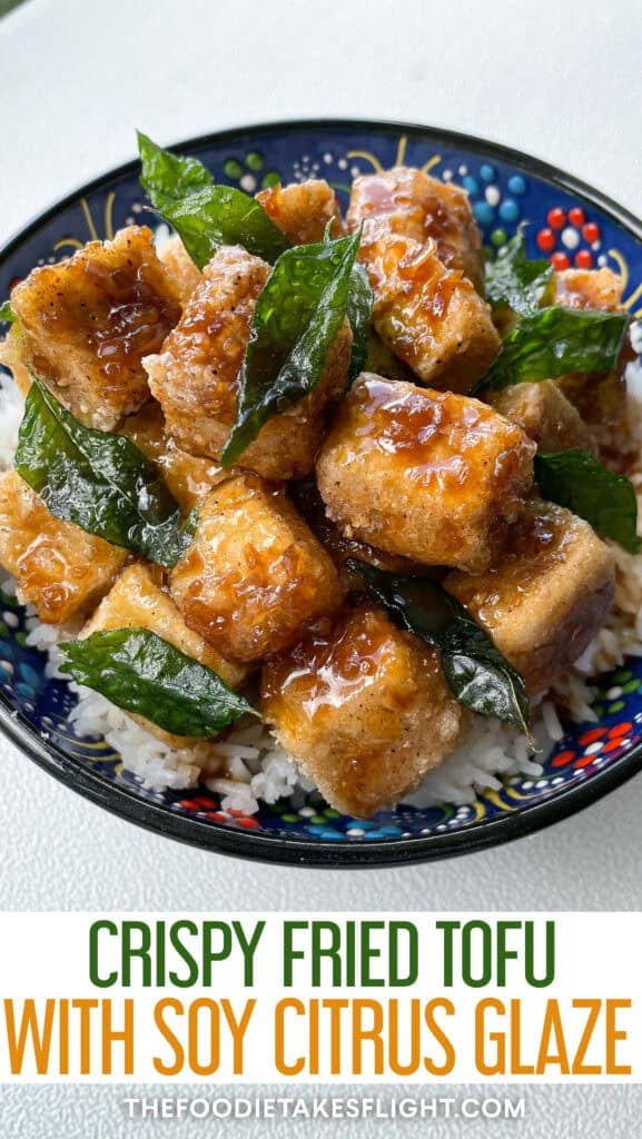 Crispy golden tofu cubes coated in a glossy soy citrus glaze, served with rice and garnished with fried curry leaves