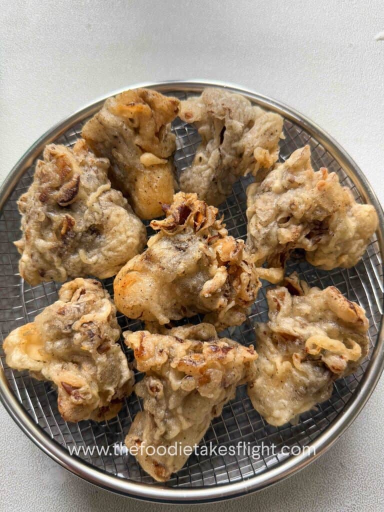 Close-up of crispy mushroom fronds with crunchy coating