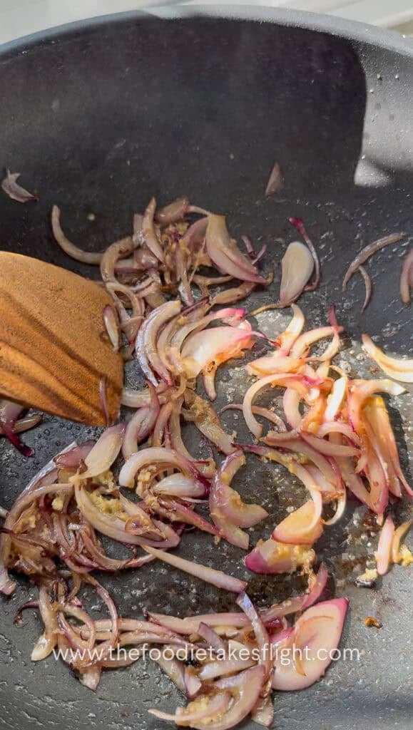 sautéing thinly sliced red onions in butter