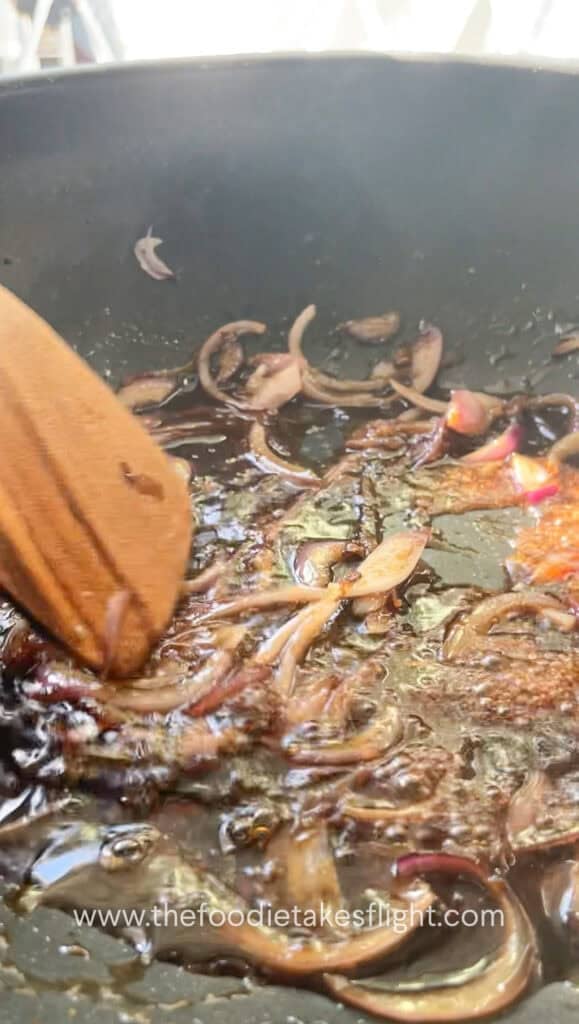 adding soy sauce, sake, and mirin to the wok with sautéed ginger and onions