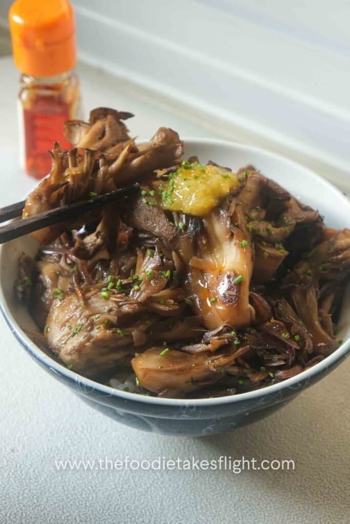 Seared maitake or hen of the wood mushrooms with earthy ginger and teriyaki sauce over steamed Japanese rice with yuzu puree