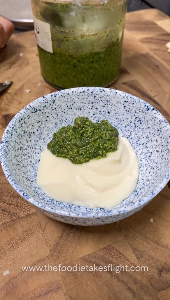 Small bowl of vegan mayo and green basil pesto