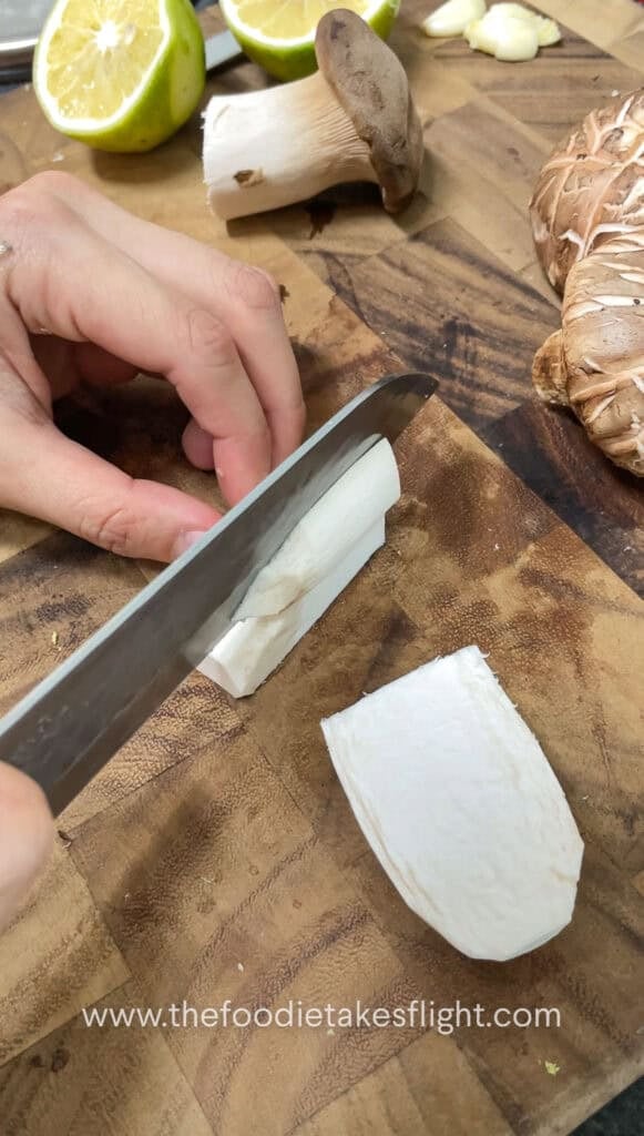 slicing king oyster mushrooms