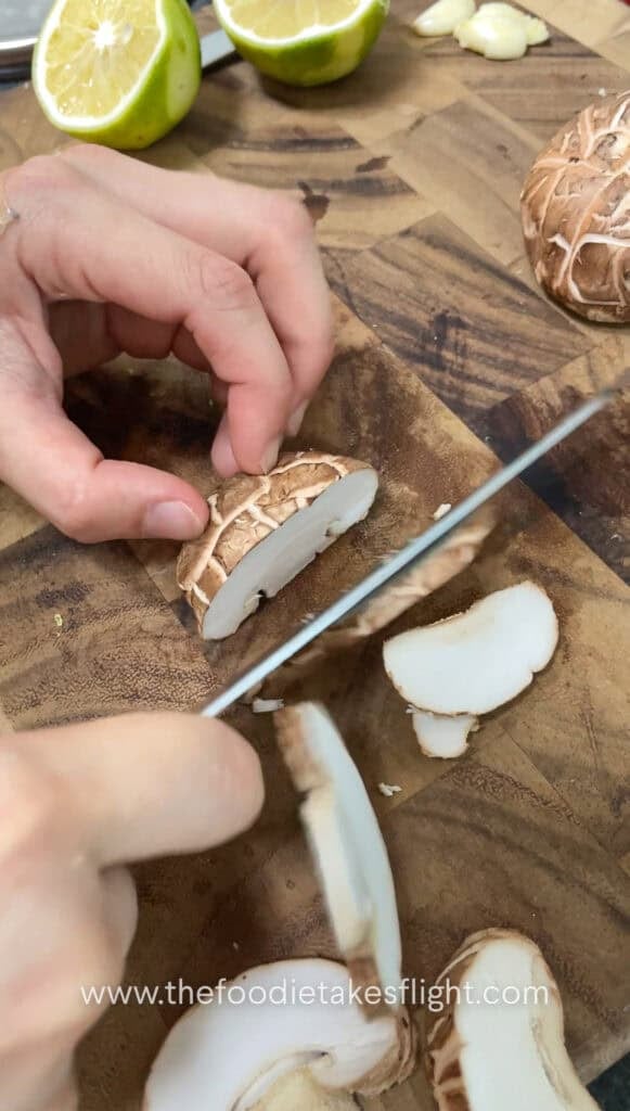slicing shiitake mushrooms