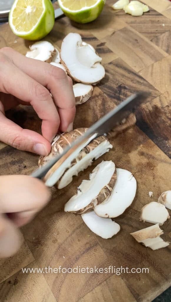 slicing shiitake mushrooms