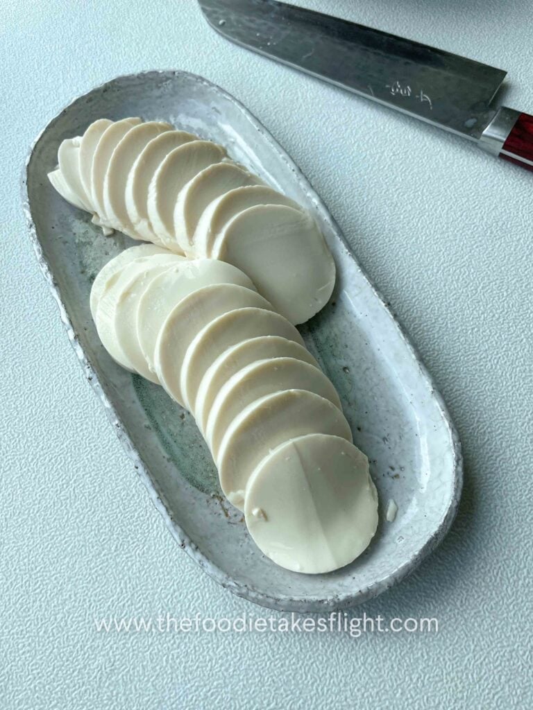 sliced cold silken tofu placed on a plate