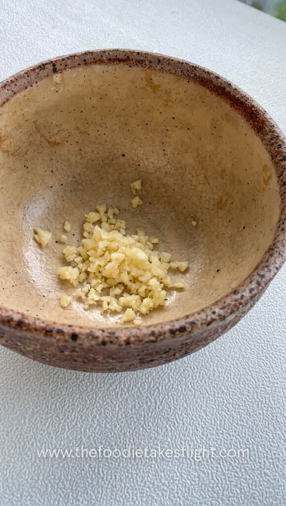 minced garlic in a heat proof bowl