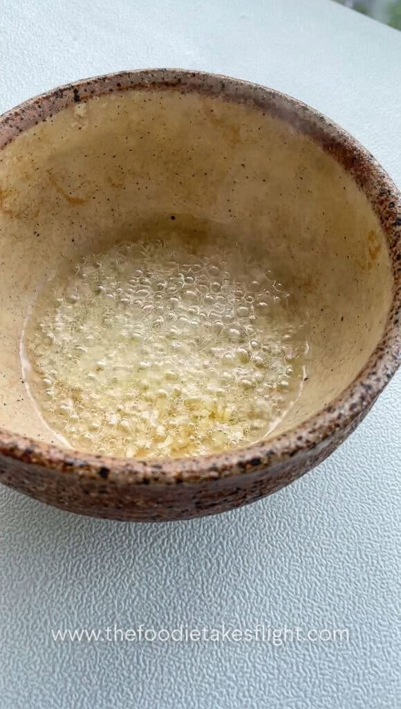 shallot garlic oil sizzling in a bowl