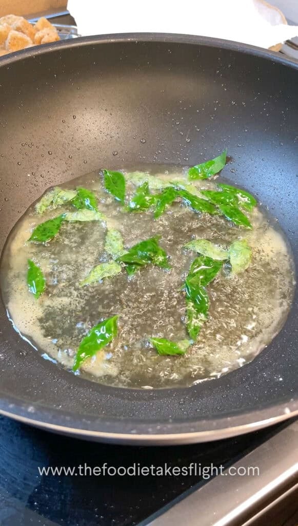 frying curry leaves in oil