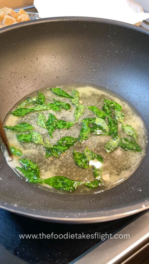 frying curry leaves in oil