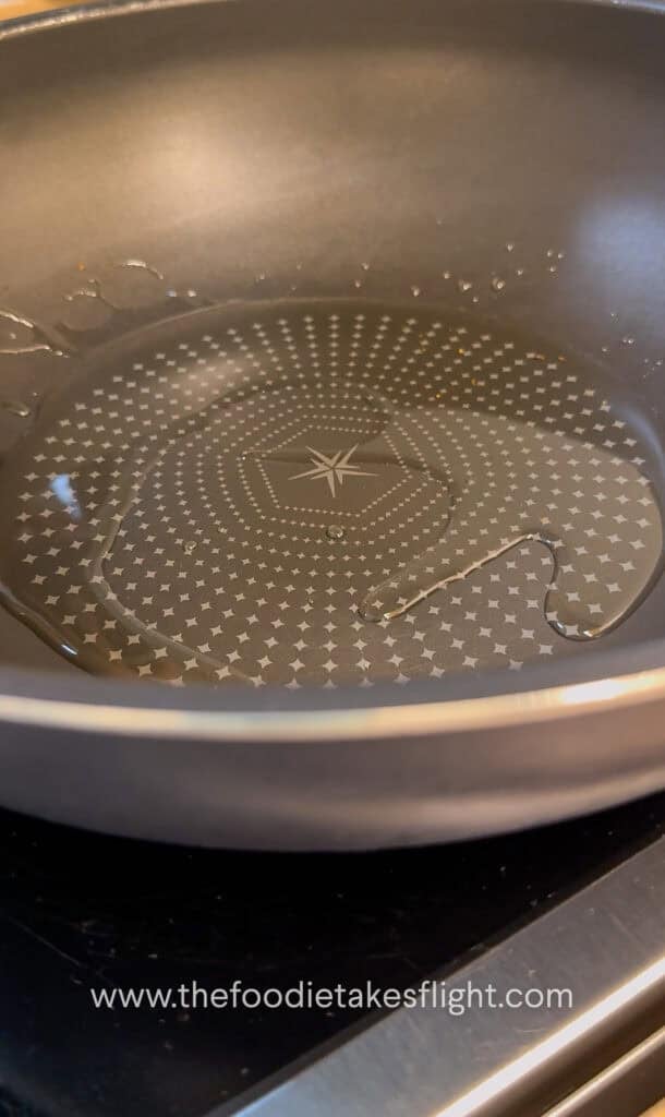 shimmering shallot oil in a wok