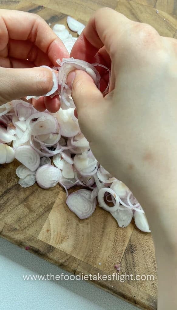 separating thinly sliced shallots