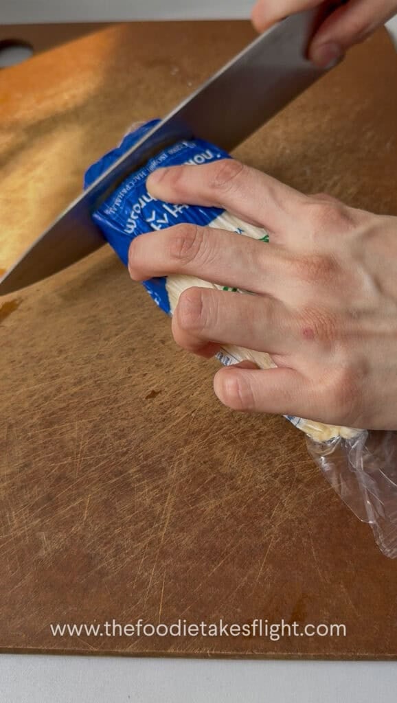 trimming the ends of the enoki mushrooms