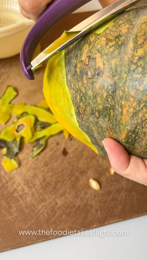Peeling squash with a peeler