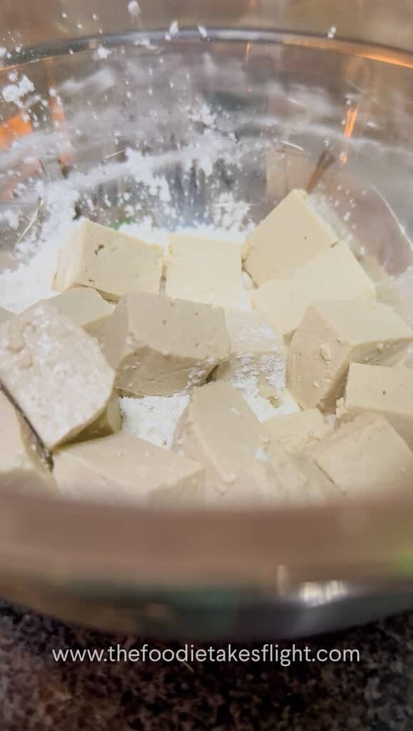 blocks of extra firm tofu tossed in flour mixture