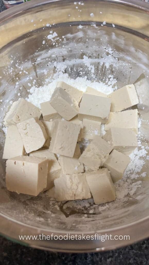 blocks of extra firm tofu tossed in flour mixture