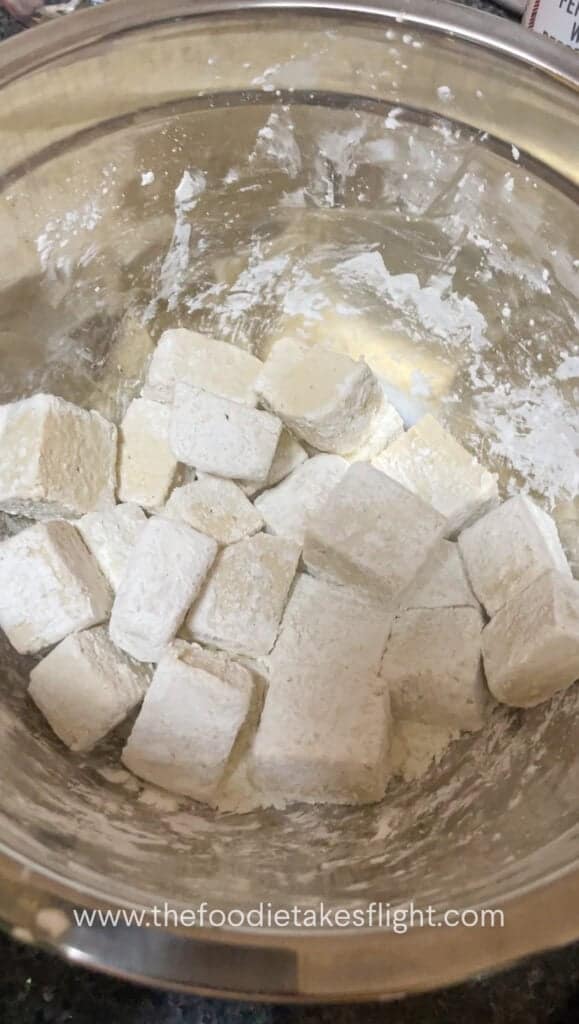 blocks of extra firm tofu tossed in flour mixture
