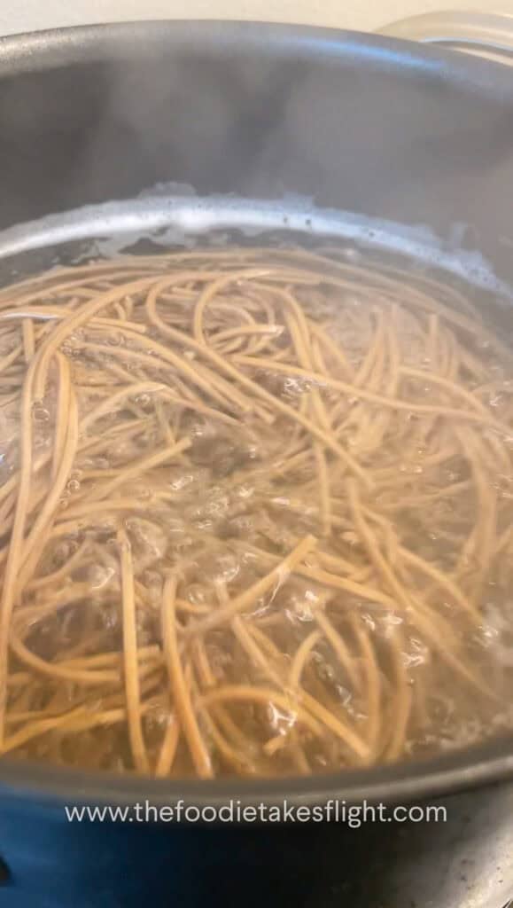 bundle of soba noodles in a pot of boiling water