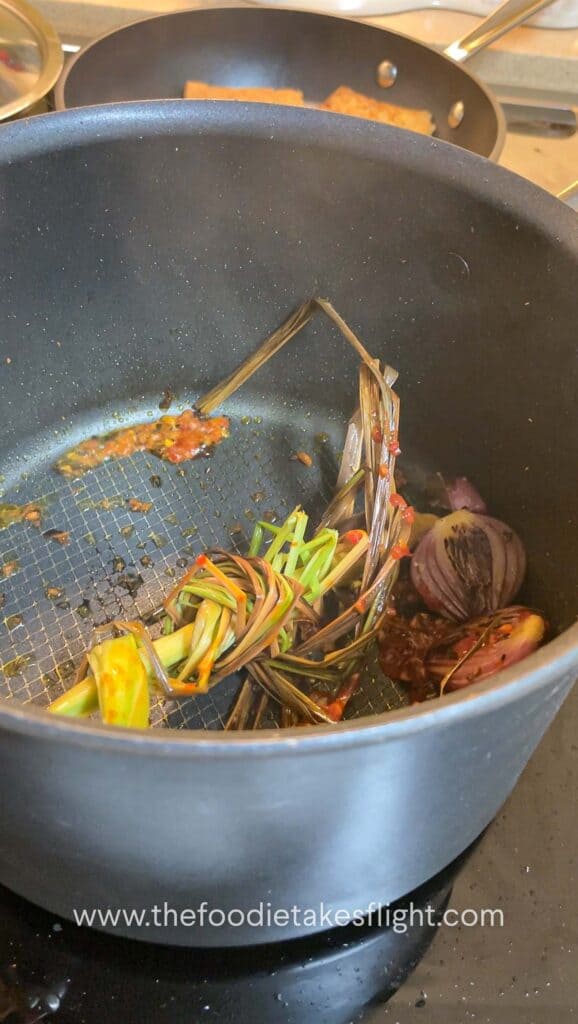 Lemongrass pot with aromatics in a soup pot