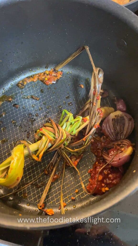 Lemongrass pot with aromatics in a soup pot