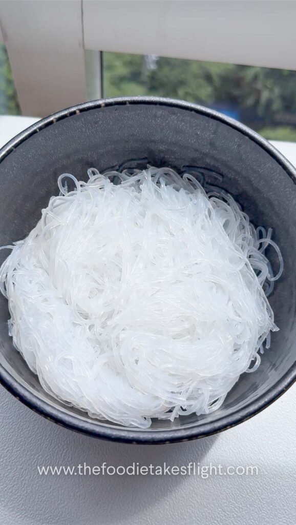 Chewy vermicelli noodles in a black bowl