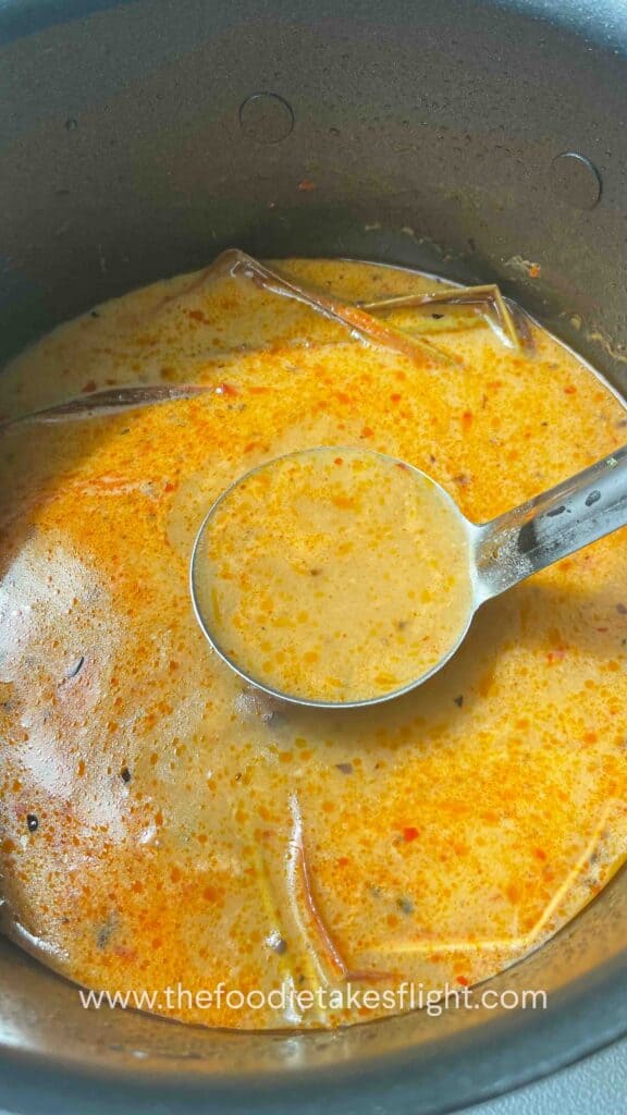 Creamy spicy lemongrass coconut soup in a pot