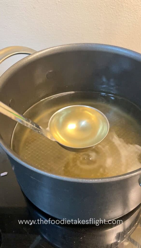 a ladle of vegetable stock