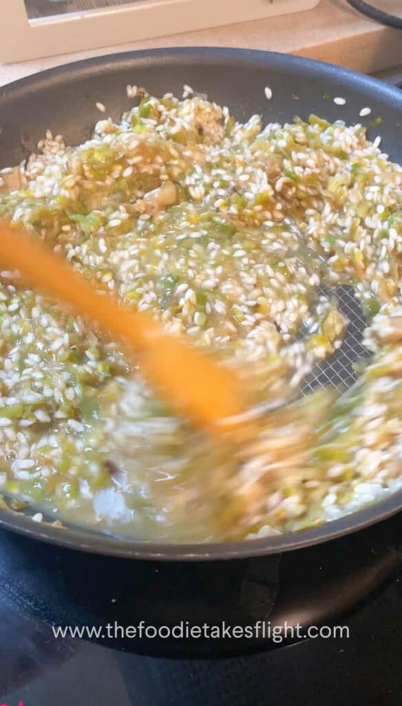 mixing the risotto in a pan