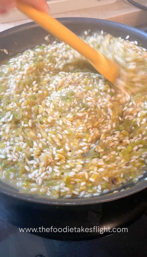 mixing the risotto in a pan