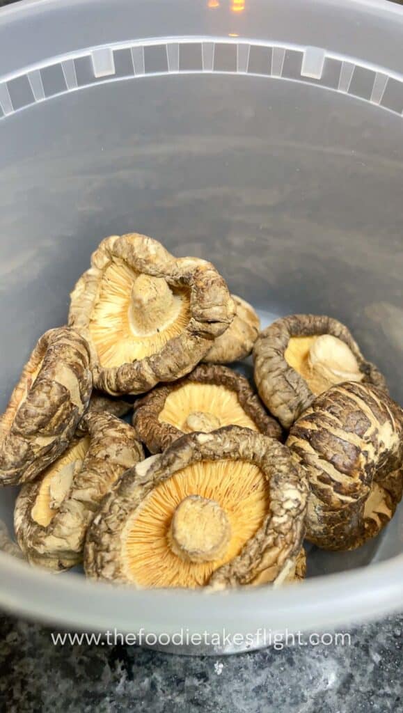 dried shiitake mushrooms in a deli container