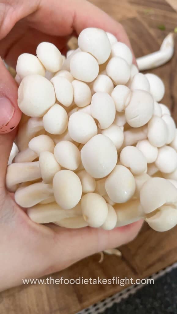 separating white shimeji mushrooms