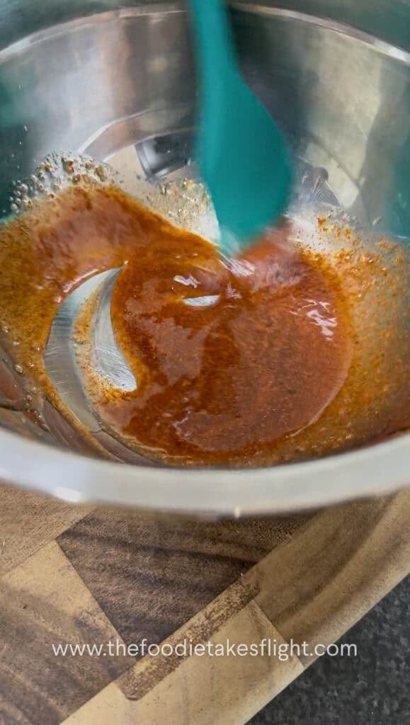 mixing shiitake mushroom bacon marinade in a bowl