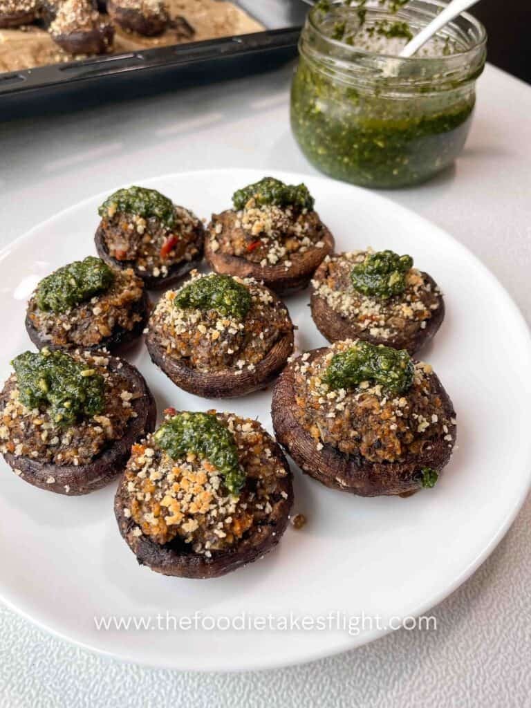 cremini mushrooms stuffed with minced mushrooms and topped with green basil pesto