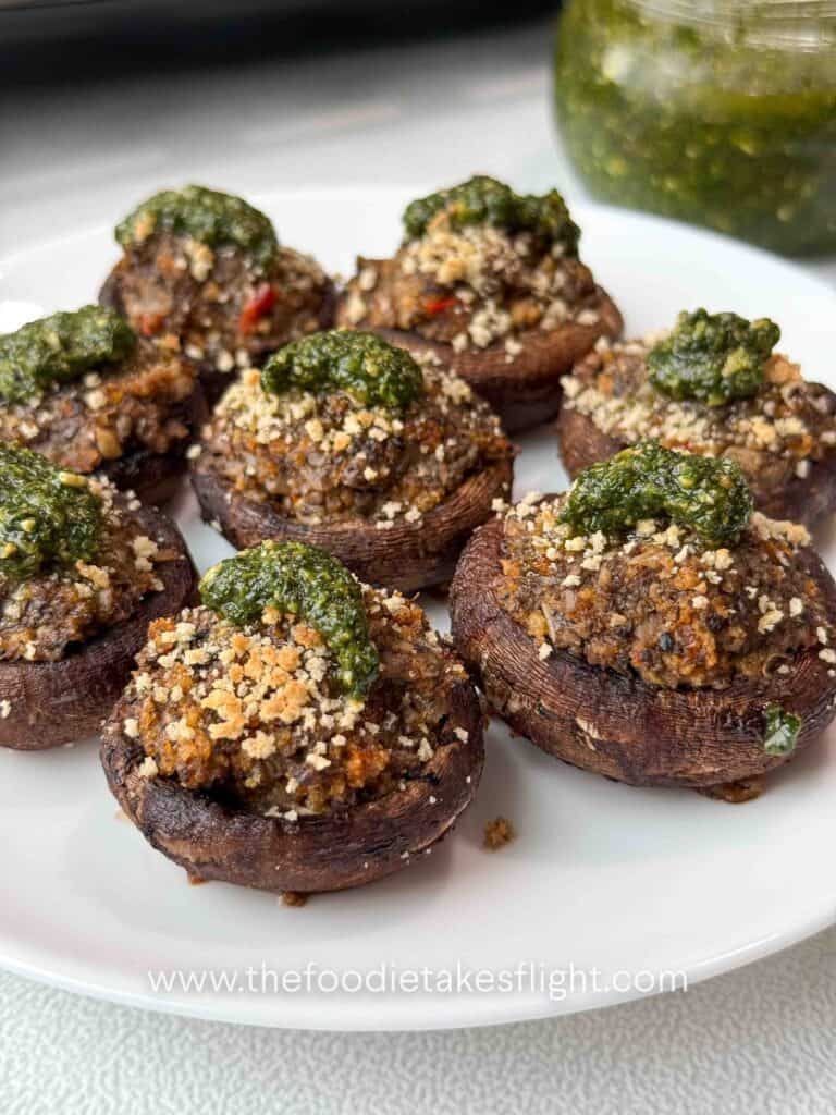 cremini mushrooms stuffed with minced mushrooms and topped with green basil pesto
