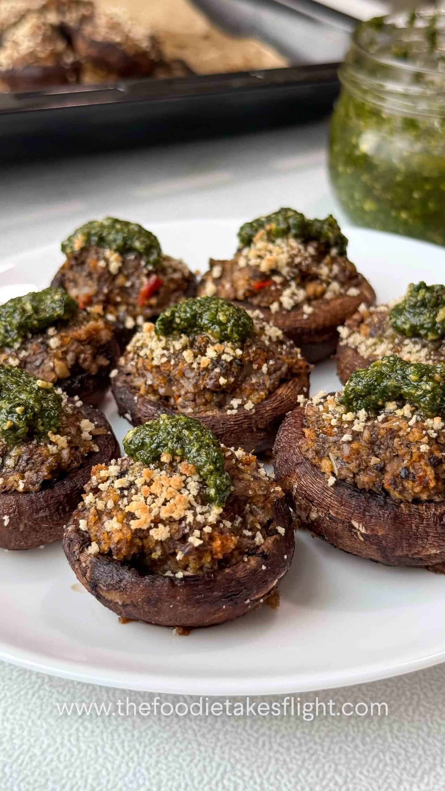 cremini mushrooms stuffed with minced mushrooms and topped with green basil pesto