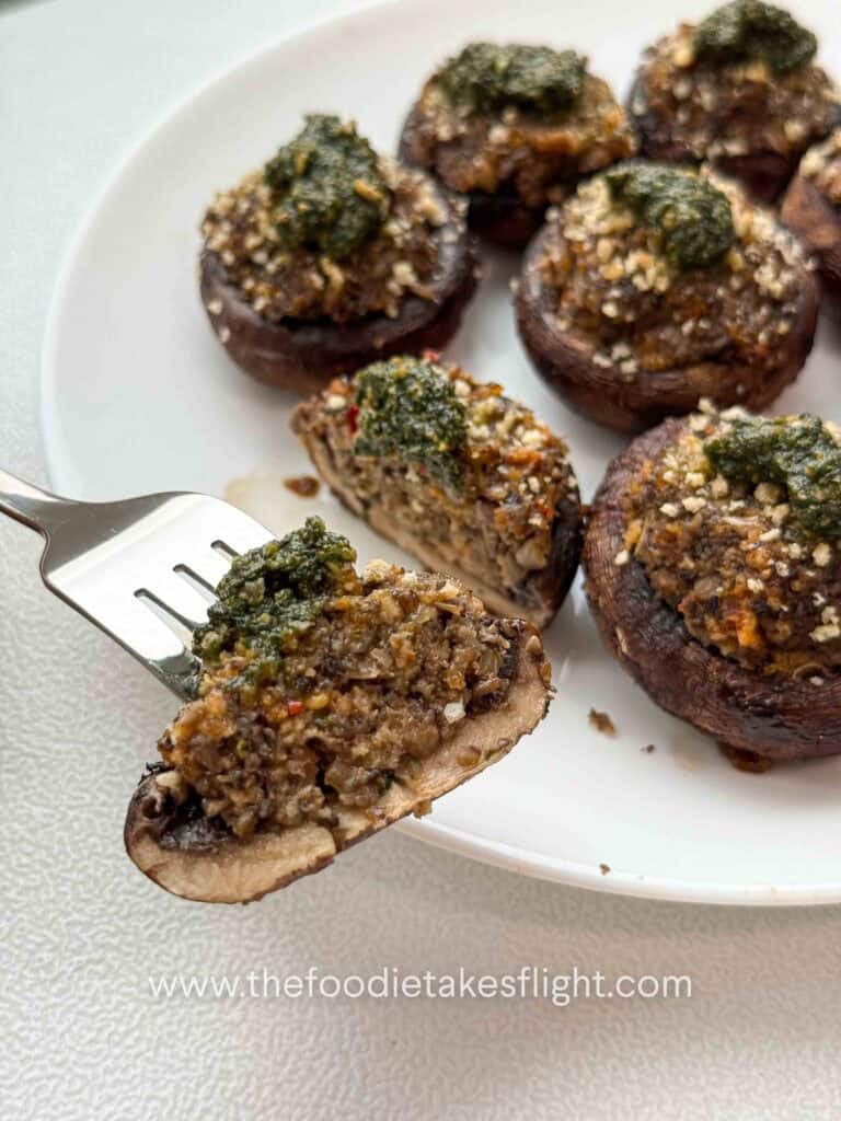 cremini mushrooms stuffed with minced mushrooms and topped with green basil pesto