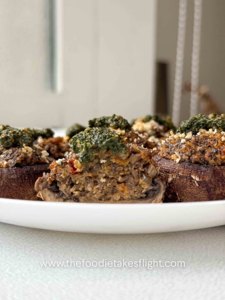 cremini mushrooms stuffed with minced mushrooms and topped with green basil pesto