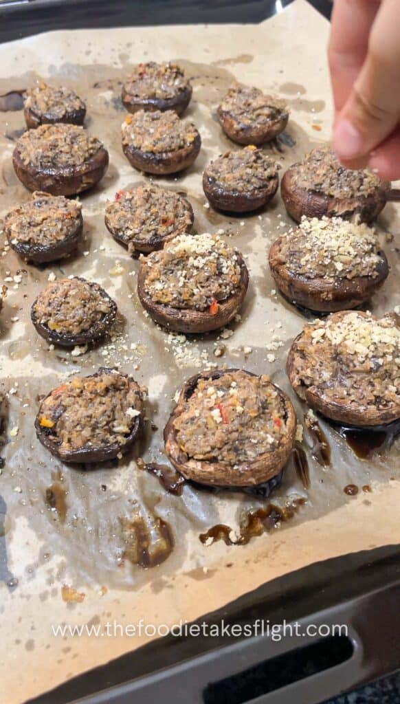 topping stuffed mushrooms with bread crumbs