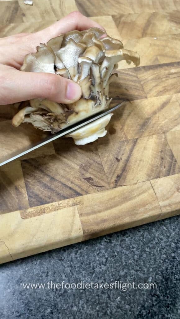 trimming the ends of maitake mushroom