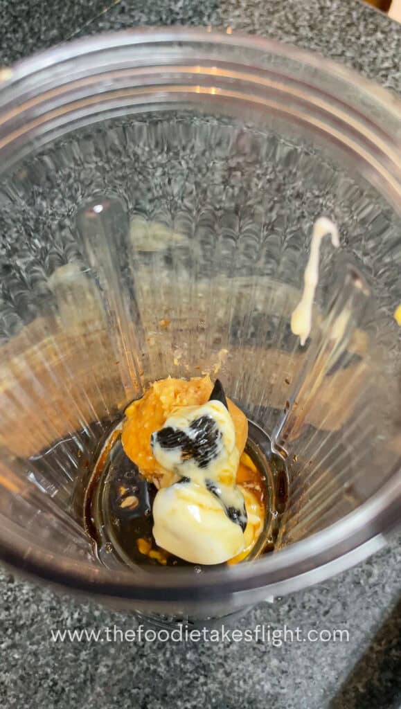 ingredients for the black garlic miso sauce in a blender
