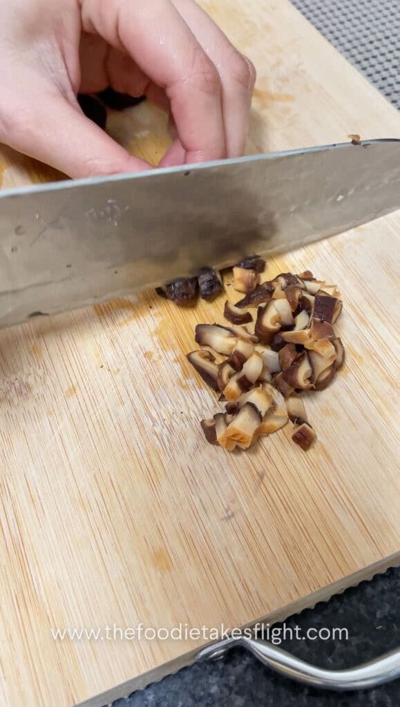 dicing rehydrated shiitake mushrooms