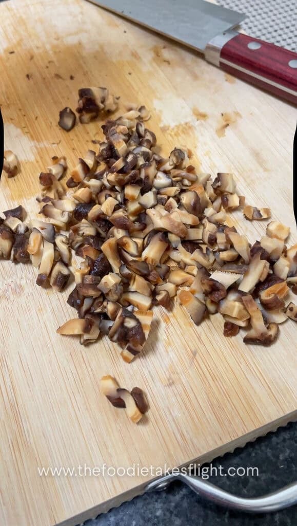 dicing rehydrated shiitake mushrooms