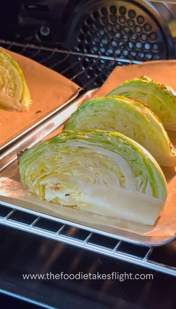 Cabbage wedges roasting in the oven until lightly charred