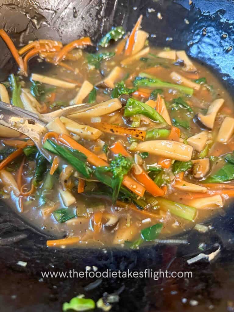 Savory gravy thickening in a wok with cornstarch