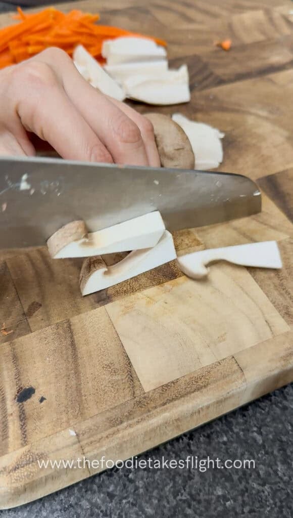 slicing king oyster mushrooms