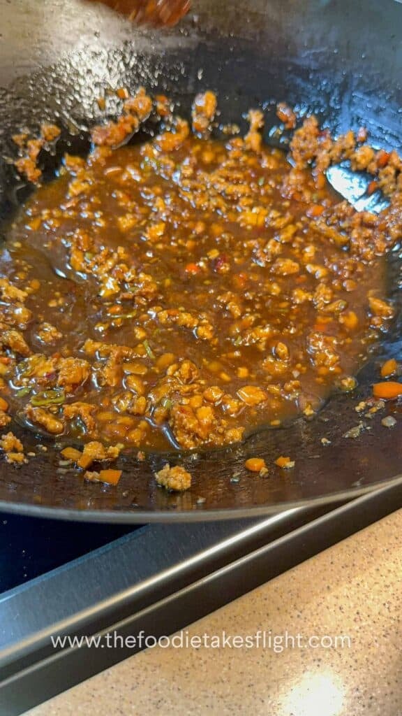 Sweet chili calamansi udon sauce in a wok